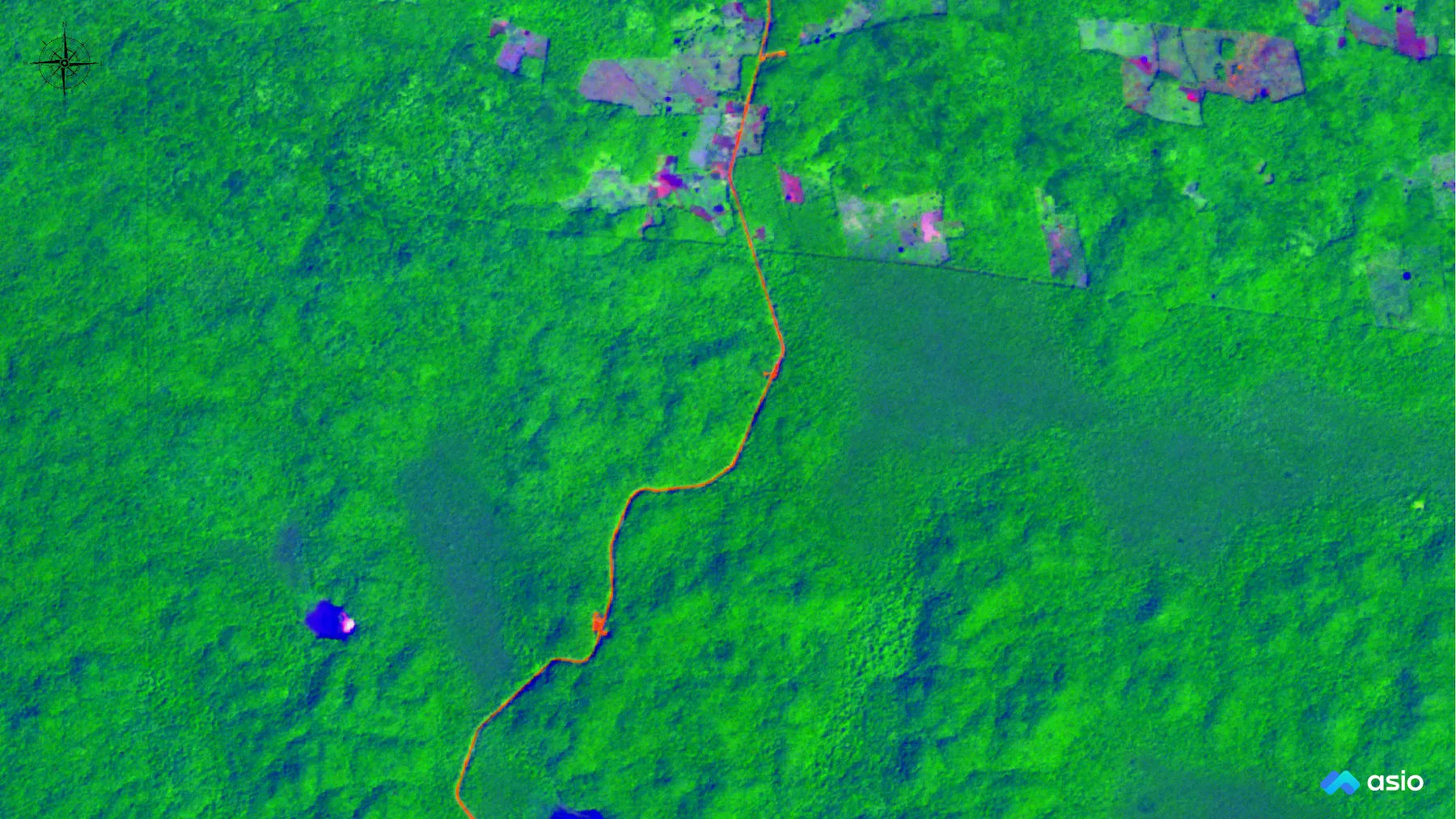 False-color composite of the first three standardized principal components of the full SuperDove scene: fields in orange and magenta, a town in green and blue, and a road crossing the upper right.